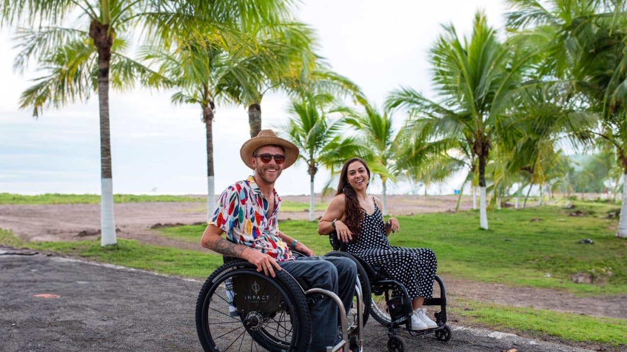 Picture of two wheelchair users traveling